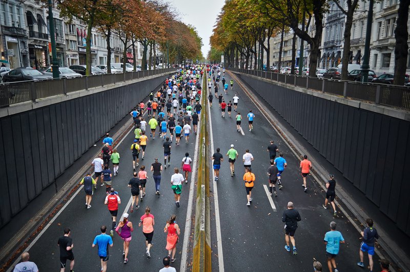 people running on road during daytime